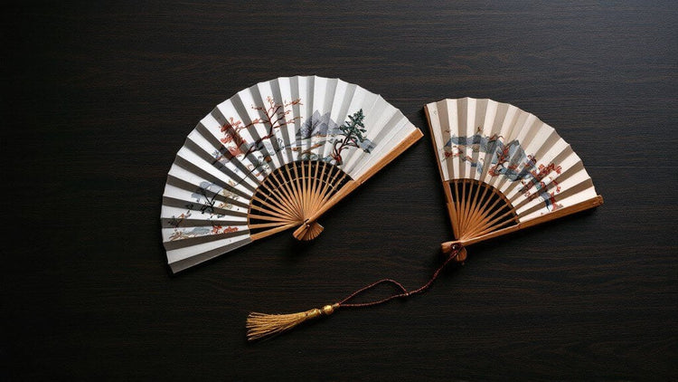Exquisitely embroidered Chinese hand fans featuring traditional motifs, showcasing fine craftsmanship and elegant design.