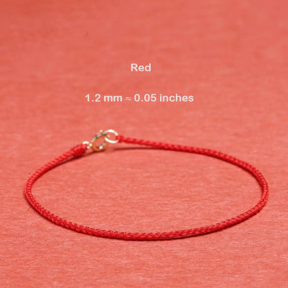 Red cord bracelet with measurement details on a red background