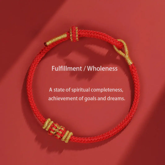 Red and gold bracelet on a red background with text about fulfillment and wholeness.