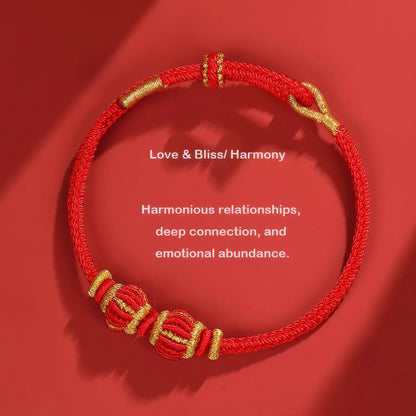 Red and gold bracelet on a red background with text about love, bliss, and harmony.