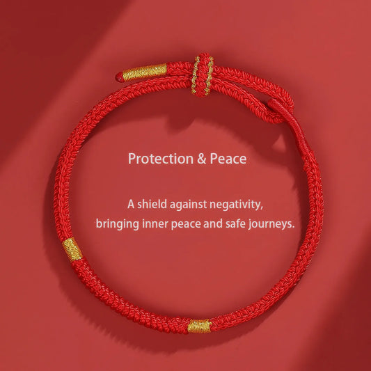 Red macramé necklace with gold accents on a red background, featuring text about protection and peace.