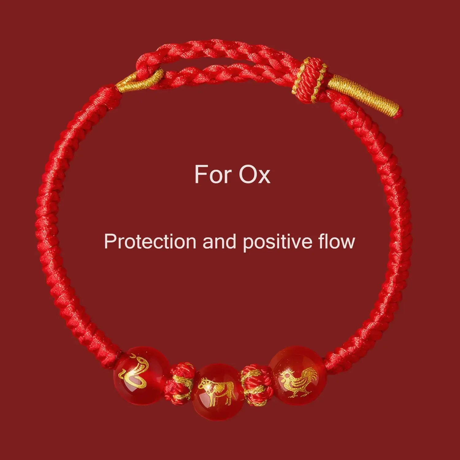 Red bracelet with gold accents and Chinese zodiac symbols on a red background