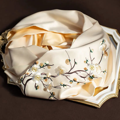 Silk scarf with floral embroidery on a dark background