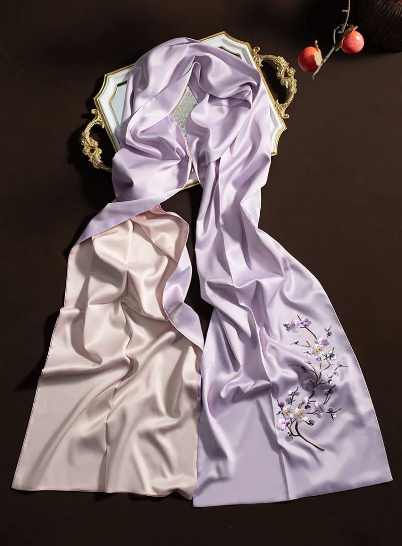 Embroidered fabric with floral design on a dark background
