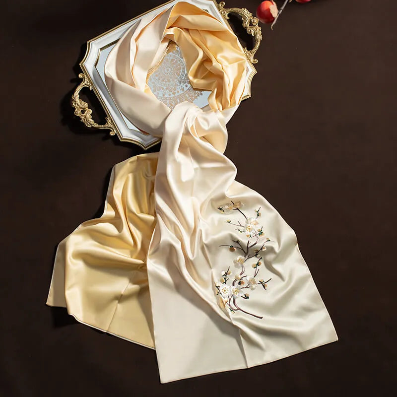 Silk scarf with floral embroidery on a dark background