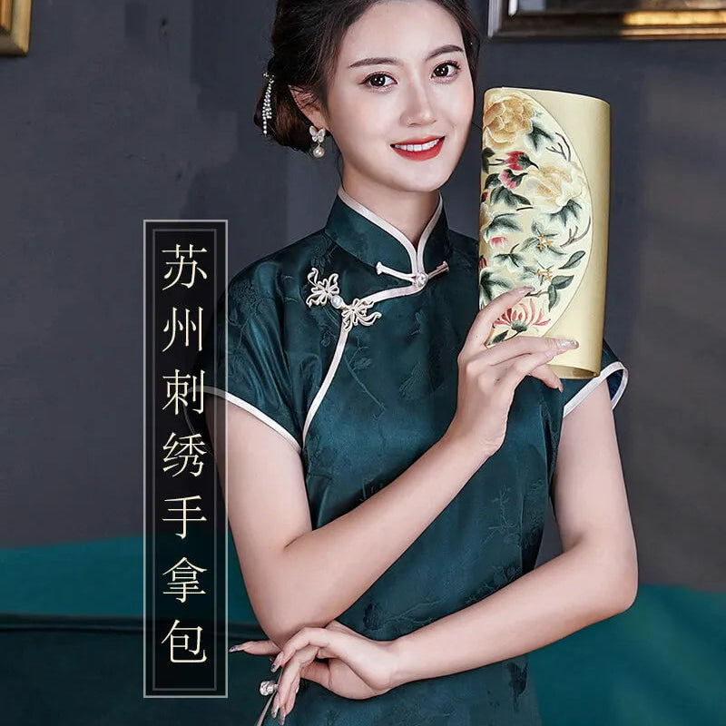 Woman in traditional outfit holding a decorative handbag with Chinese text on a dark background