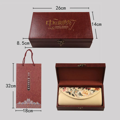 Red gift box with dimensions and a hanging tag on a gray background