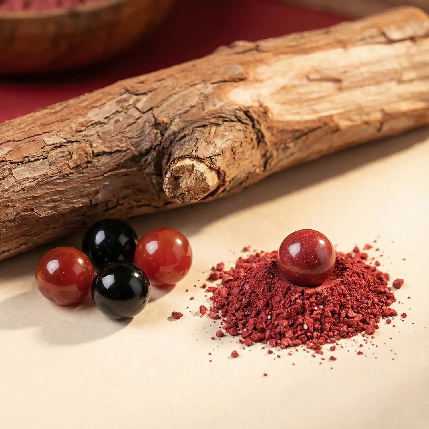 Red berries and red powder on a wooden surface