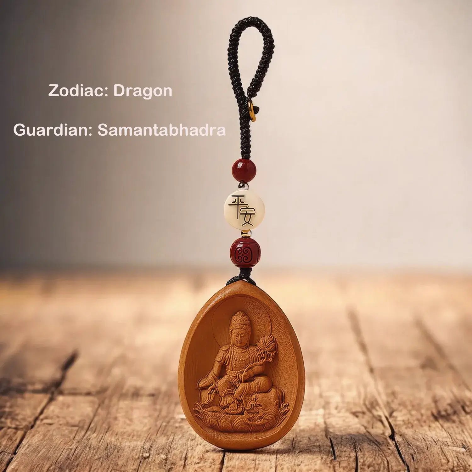 Wooden pendant with engraved figure on a wooden surface, featuring text about zodiac and guardian.