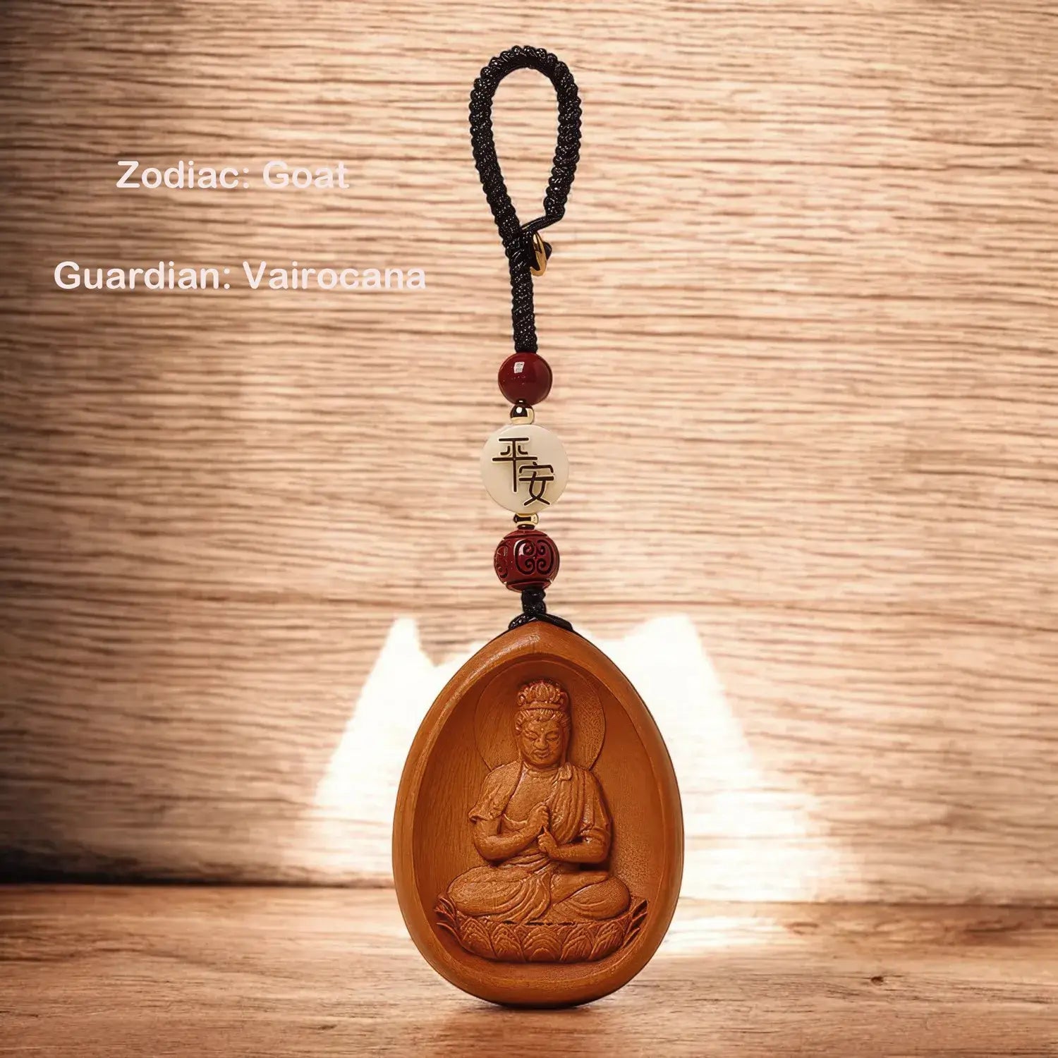 Wooden pendant with Buddha figure on a wooden background