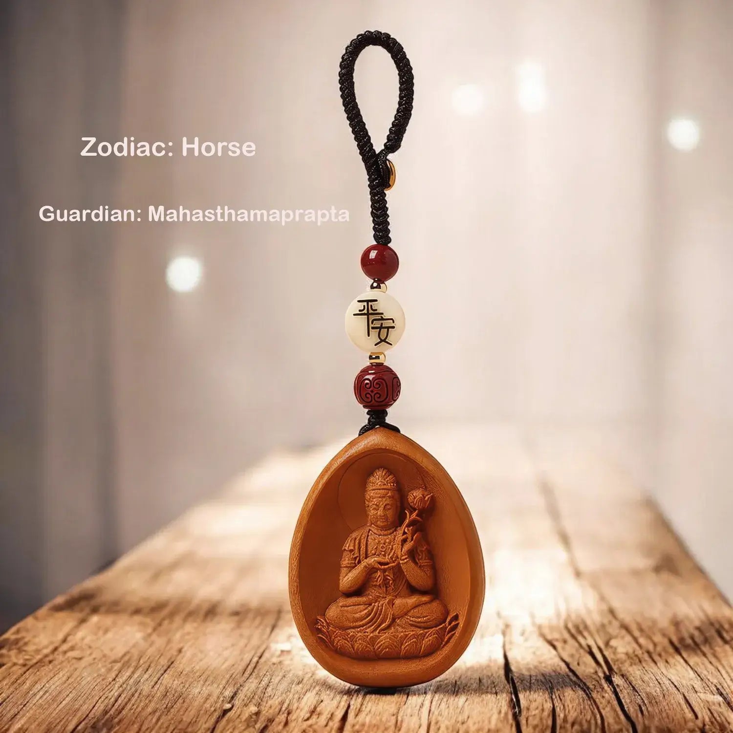 Wooden pendant with Buddha figure and beads on a wooden surface