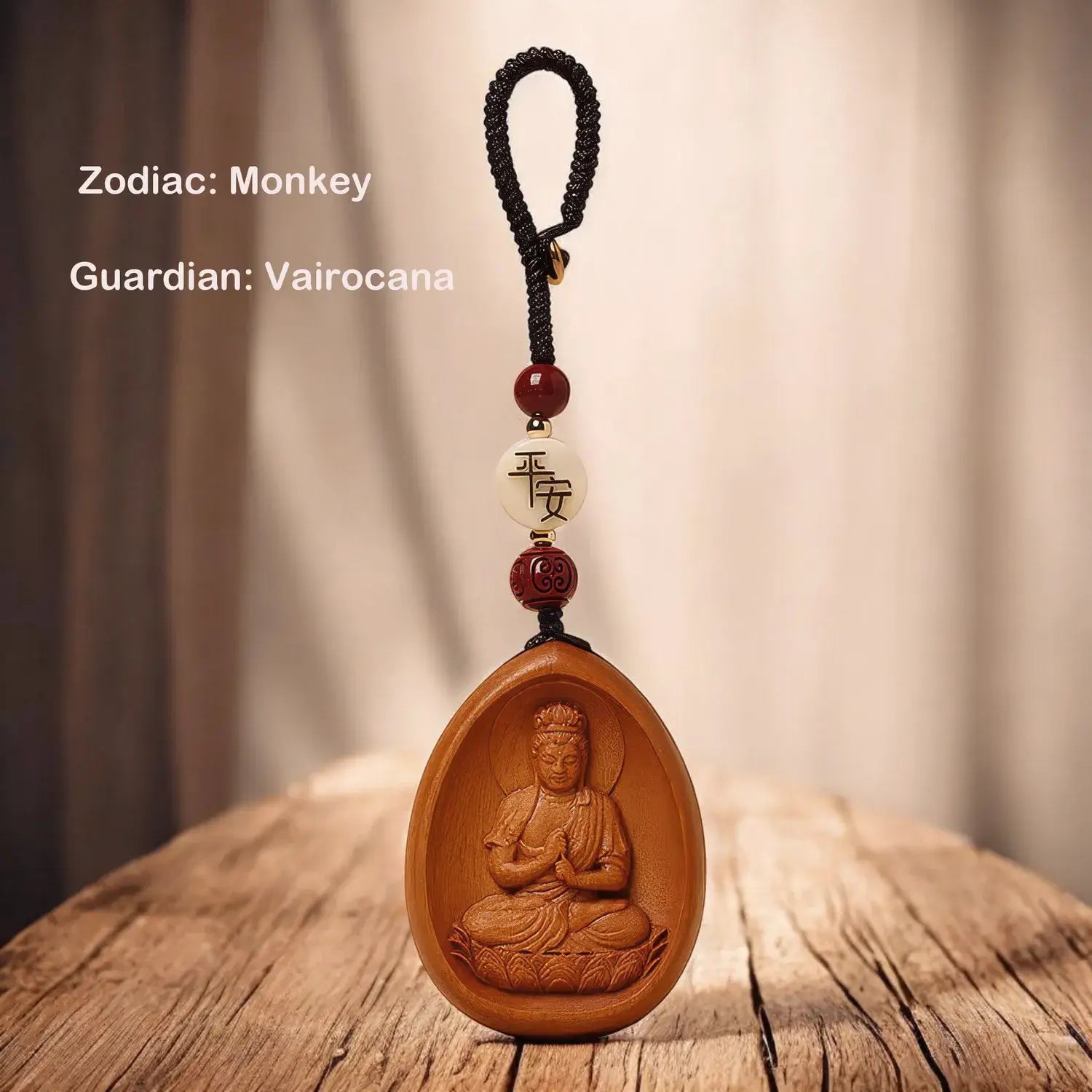 Wooden pendant with Buddha figure and beads on a wooden surface