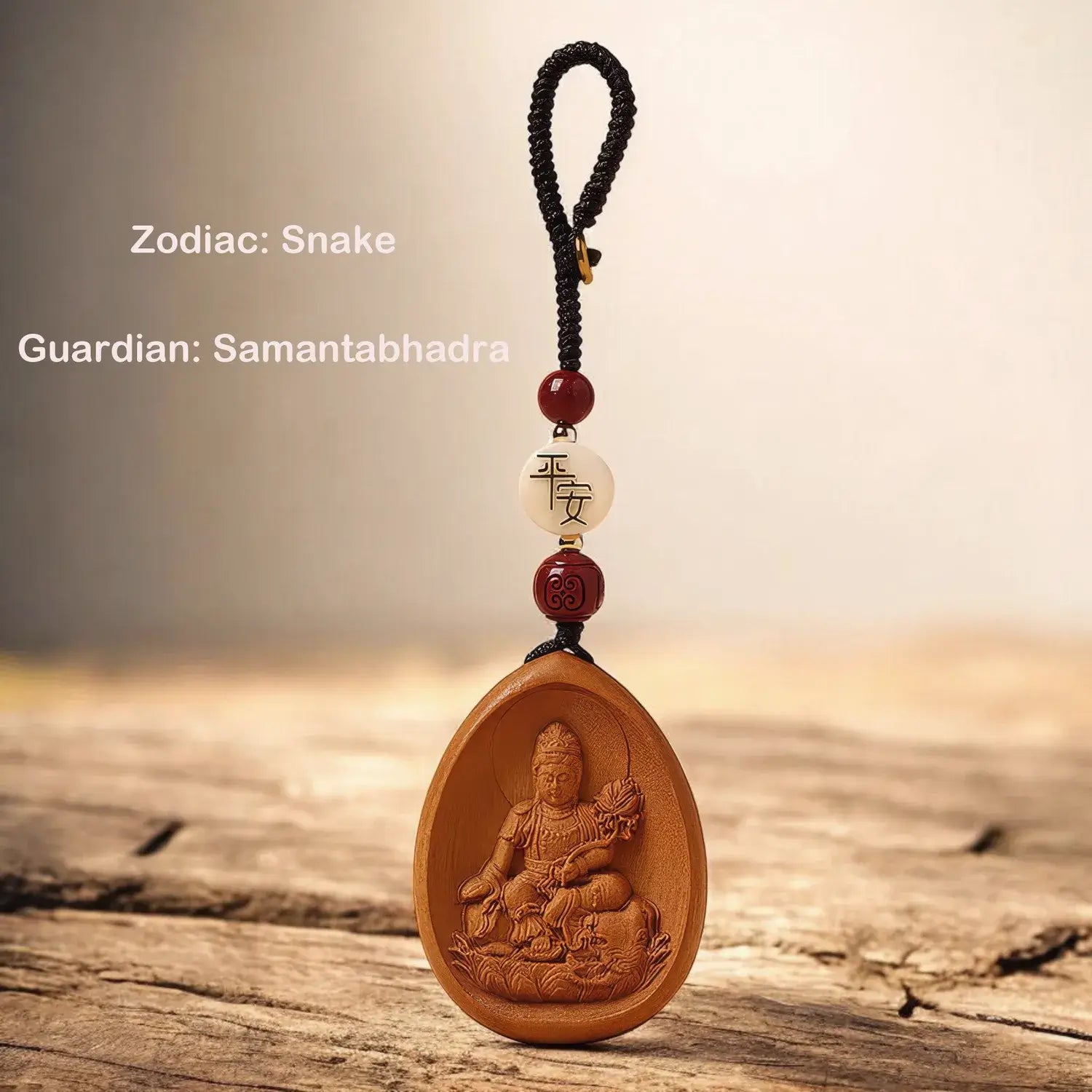 Wooden pendant with engraved figure and beads on a wooden surface