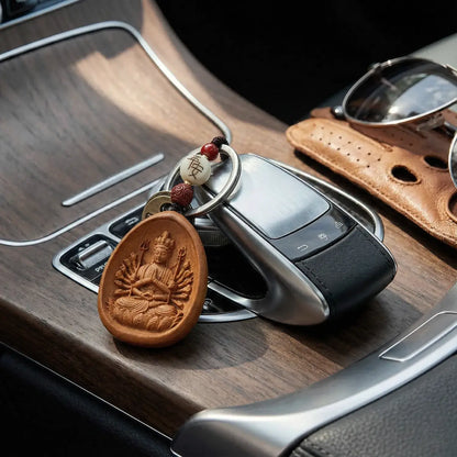 Car key with a wooden pendant on a car dashboard