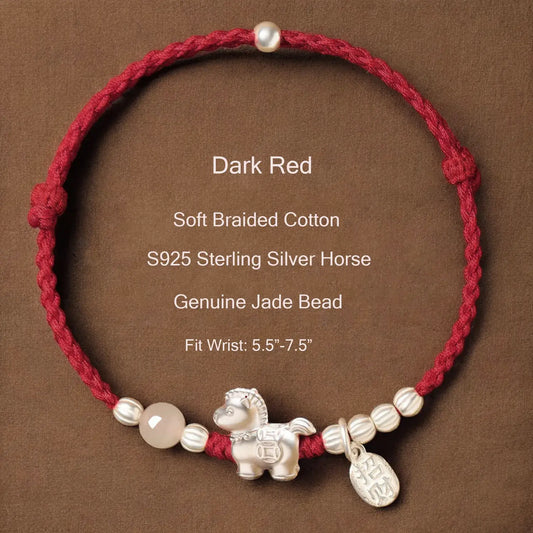 Dark red braided cotton bracelet with silver horse charm and jade bead on a brown background