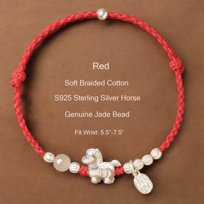 Red braided cotton bracelet with silver horse charm and jade bead on a brown background