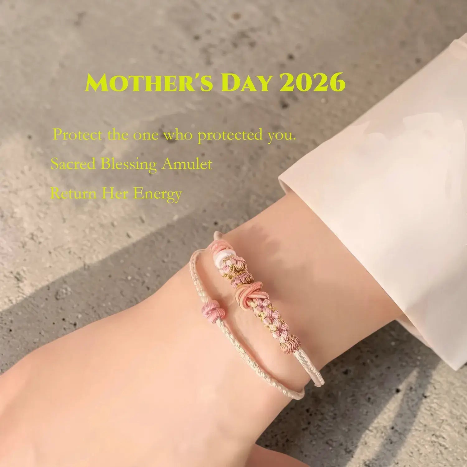 Bracelet on a wrist with text about a 'Sacred Blessing Amulet' for Mother's Day 2026.