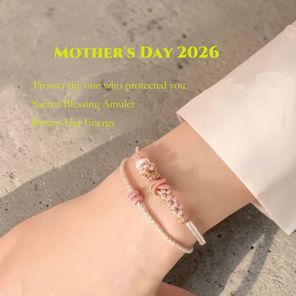 Bracelet on a wrist with text about a 'Sacred Blessing Amulet' for Mother's Day 2026.
