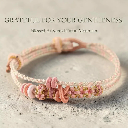 Pink and gold braided bracelet on a textured surface with text overlay.