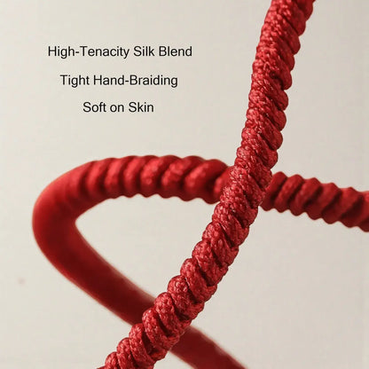 Red braided cord with text on a beige background