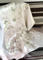 Floral patterned fabric draped over a chair with a striped background
