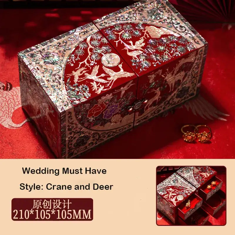 Decorative jewelry box with crane and deer design on a red background