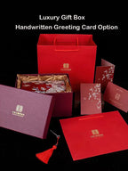 Collection of luxury gift boxes with a handwritten greeting card option on a black background