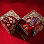 Decorative jewelry box with floral patterns on a red background
