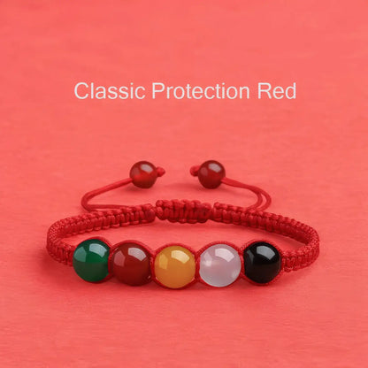 Colorful bracelet with beads on a red background, labeled 'Classic Protection Red'.