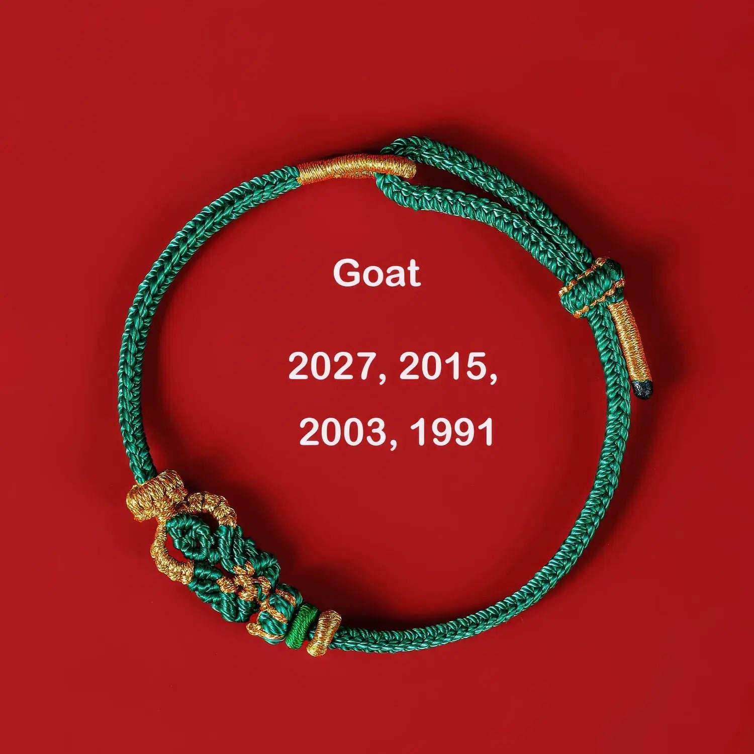 Green bracelet with gold accents on a red background, featuring years associated with the 'Goat' animal symbol.