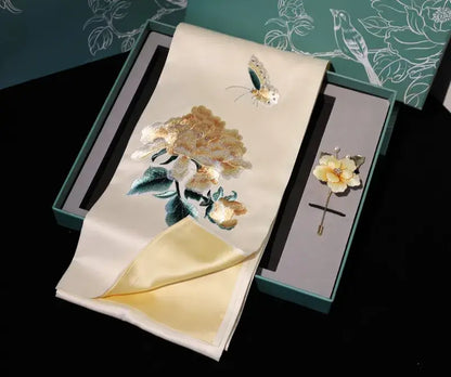 Embroidered scarf with floral design and brooch in a box