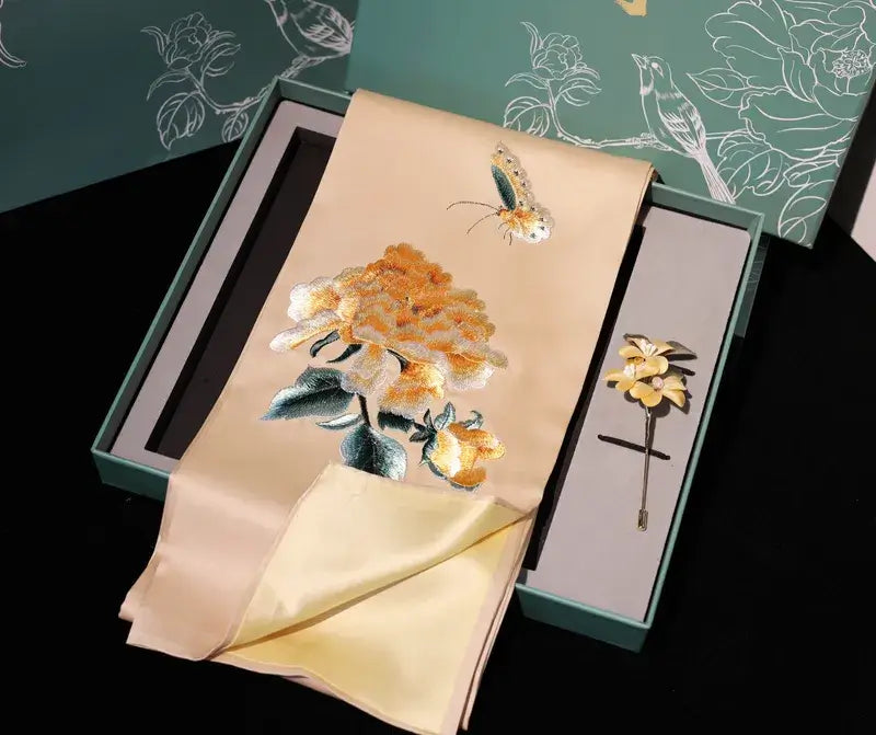 Embroidered flower brooch in a decorative box with floral design