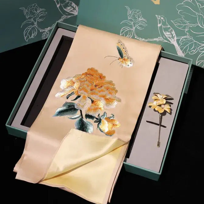 Embroidered flower brooch in a decorative box with floral design