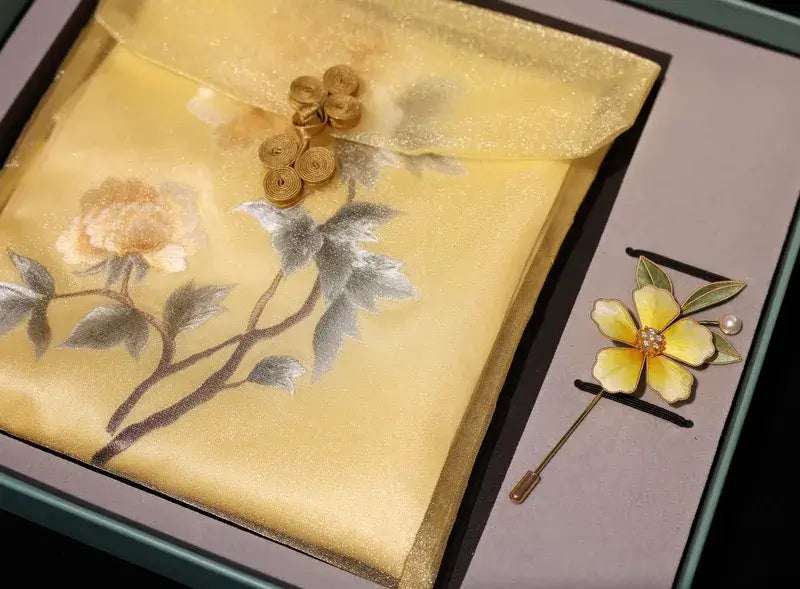 Decorative brooch with floral design on a matching fabric background