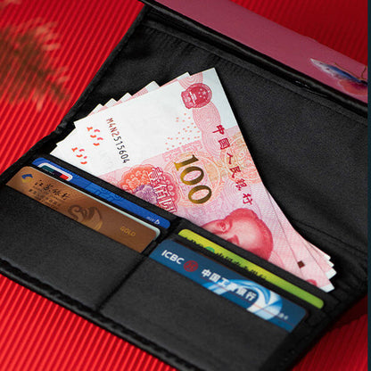 Black wallet with banknotes and cards on a red background