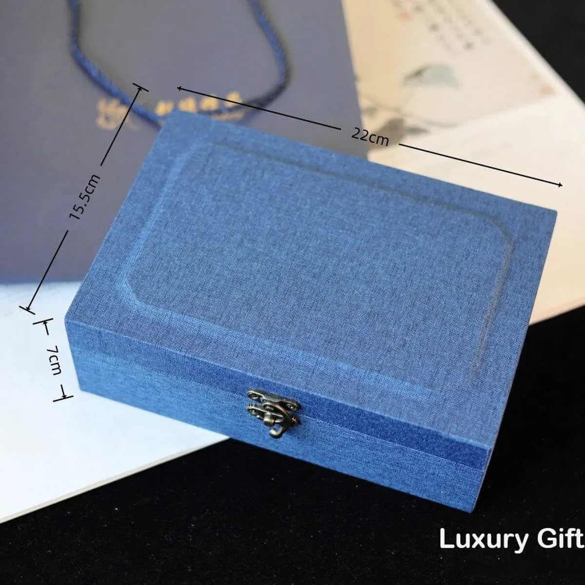 Blue luxury gift box with dimensions and 'Luxury Gift Box' text on a dark surface.