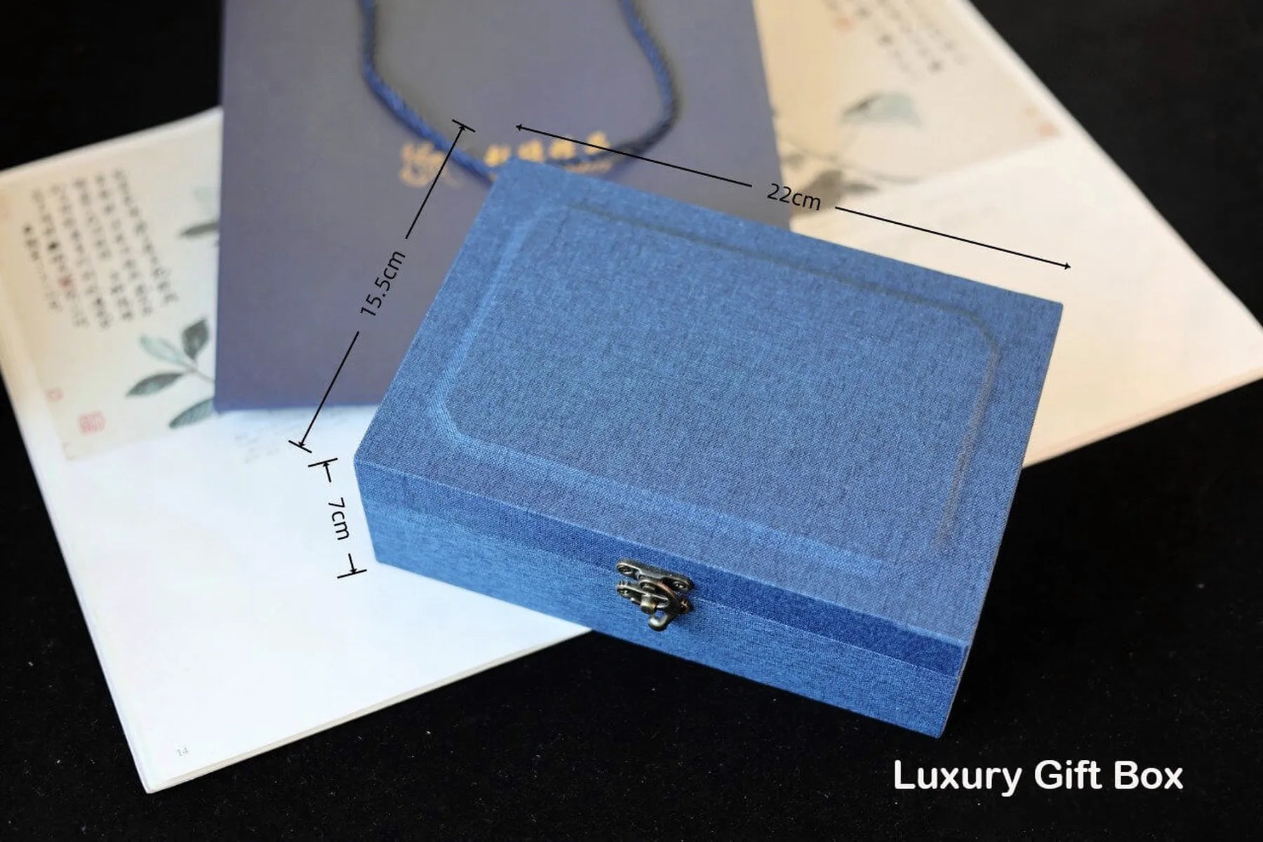 Blue luxury gift box with dimensions and 'Luxury Gift Box' text on a dark surface.