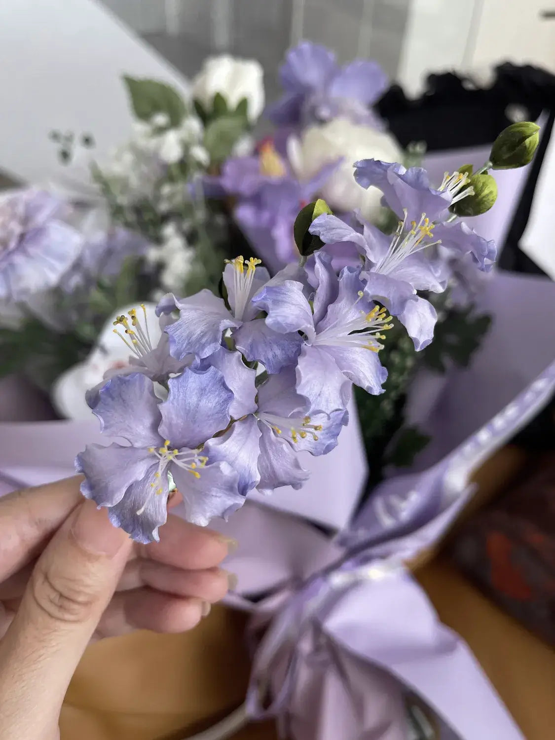 Close-up of a bouquet of purple flowers with a blurred background