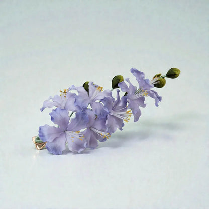 Purple flower arrangement on a light gray background