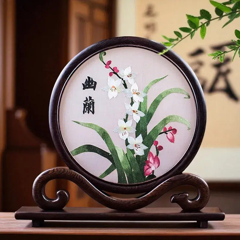 Decorative piece with floral design on a wooden stand