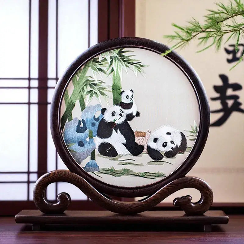 Decorative plate with panda design on a wooden stand
