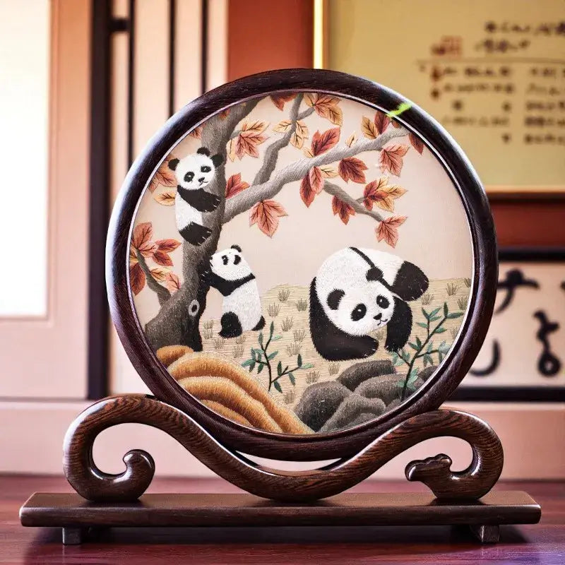 Decorative plate with panda design on a wooden stand