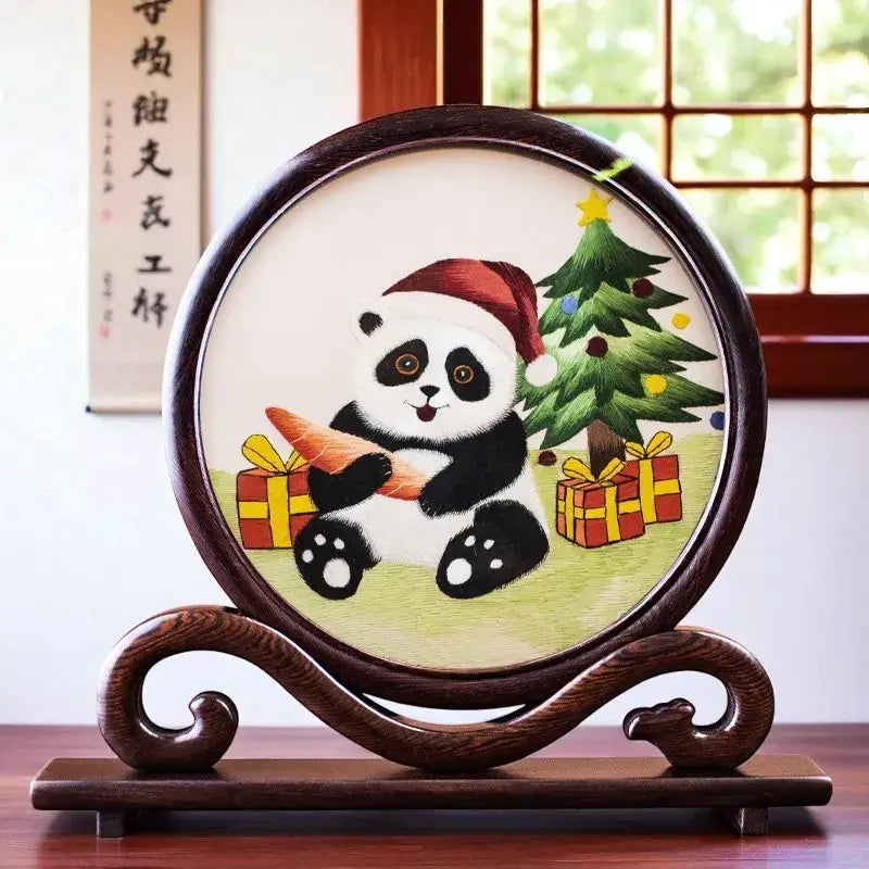 Decorative plate with a panda holding an ice cream cone and Christmas tree, on a wooden stand.