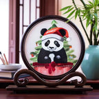 Decorative piece with a panda bear wearing a Santa hat on a Christmas tree, displayed on a wooden stand.