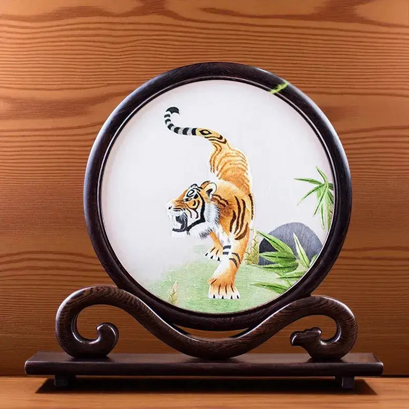 Decorative plate with a tiger design on a wooden stand against a wooden background