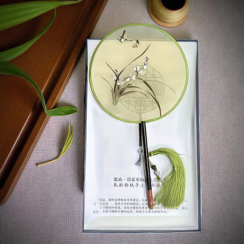 Decorative fan with floral design on a textured surface