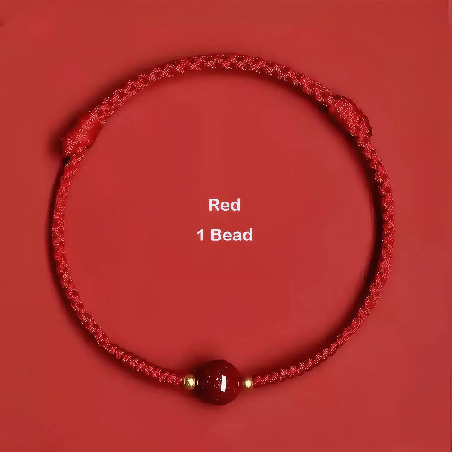 Red braided bracelet with a single red bead on a red background