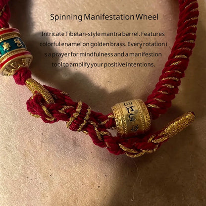 Spinning manifestation wheel with Tibetan-style mantras on a beige background