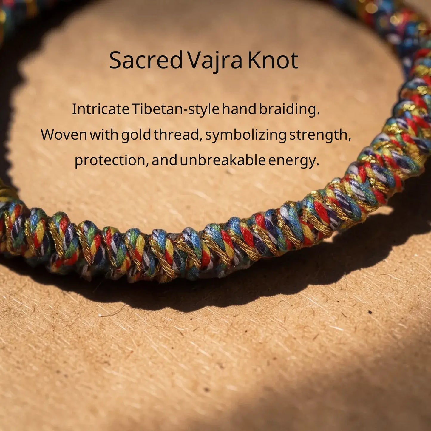Colorful Sacred Vajra Knot bracelet on a wooden surface with descriptive text.