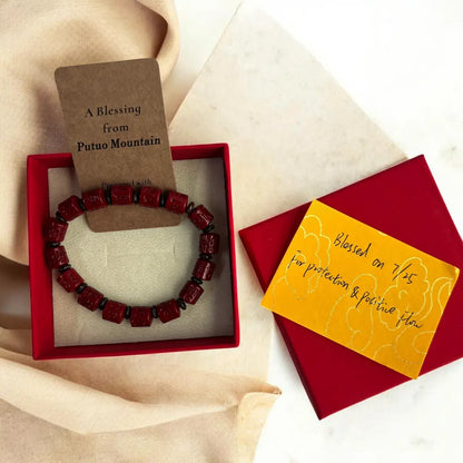 Rotating Cinnabar Prayer Wheel Bracelet